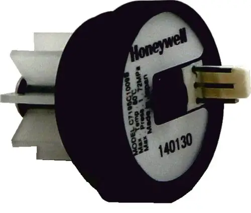 Flügelraddurchflusssensor von Honeywell mit Anschlussstecker, verwendet in Wolf-Heizsystemen. Das Gerät misst den Durchfluss in Heizungsanlagen.